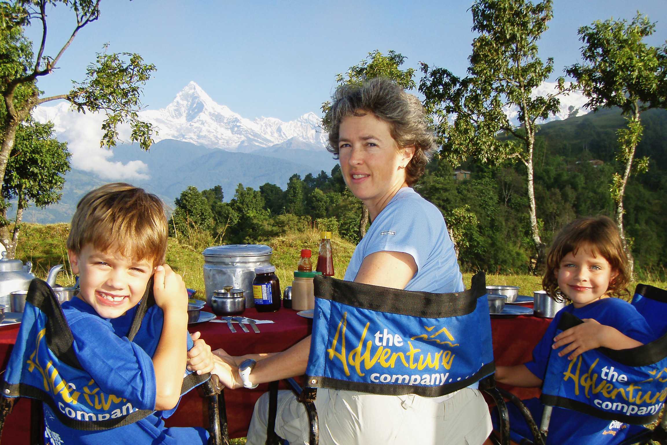 Family eating with Mt. Everest